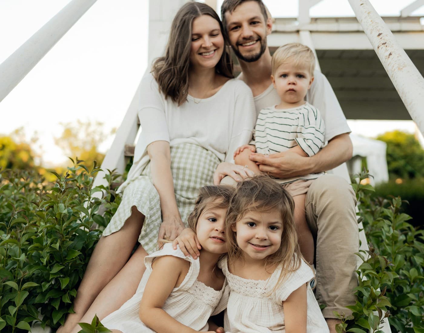 Smiling Canadian family of four spending time together outdoors