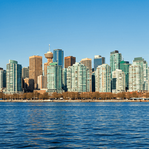 Toronto skyline at dusk with the CN Tower lit against a deep blue sky