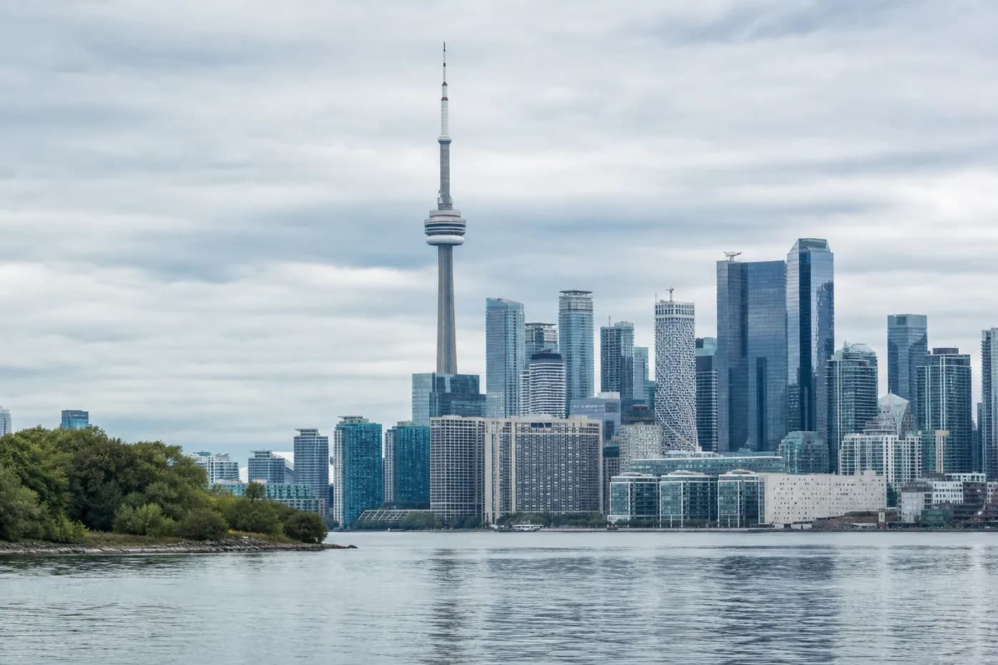 Toronto skyline and the CN Tower seen across Lake Ontario from the Toronto Islands on an overcast day, Ontario